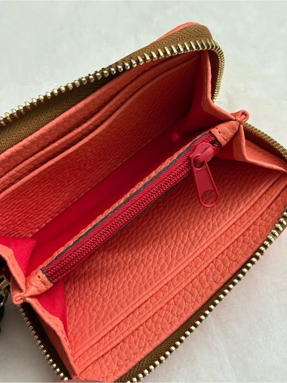 Dooney & Bourke Pebble Grain Large Zip Around Credit Card Case  Coral Color.